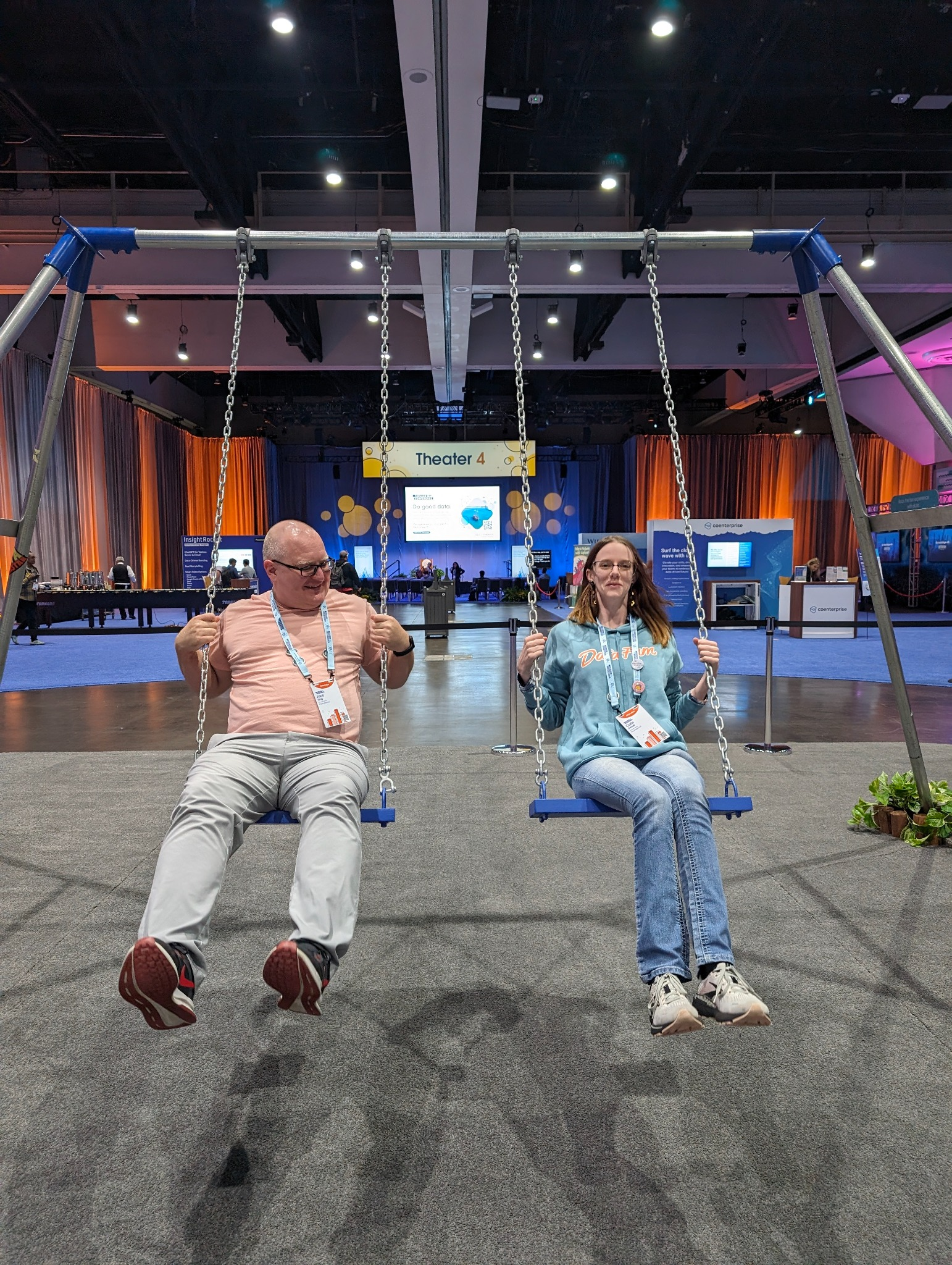 Jack King and Carin Detzel on swings at a data conference